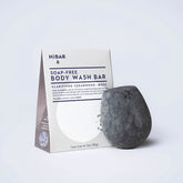 HiBAR Clarifying Cedarwood + Moss Body Wash Bar on white surface, showing zero‑plastic packaging