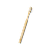 Huppy bamboo toothbrush showing natural wood grain handle with white soft bristles against clean white background
