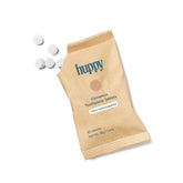 Huppy Cinnamon Toothpaste Tablets Refill - kraft brown compostable pouch showing 62 tablets with cinnamon flavour label and sustainable packaging design