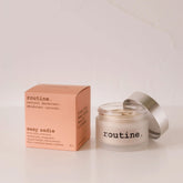 routine Sexy Sadie natural deodorant - coral pink packaging box next to open glass jar showing cream-coloured deodorant - vegan aluminum-free formula for sensitive skin