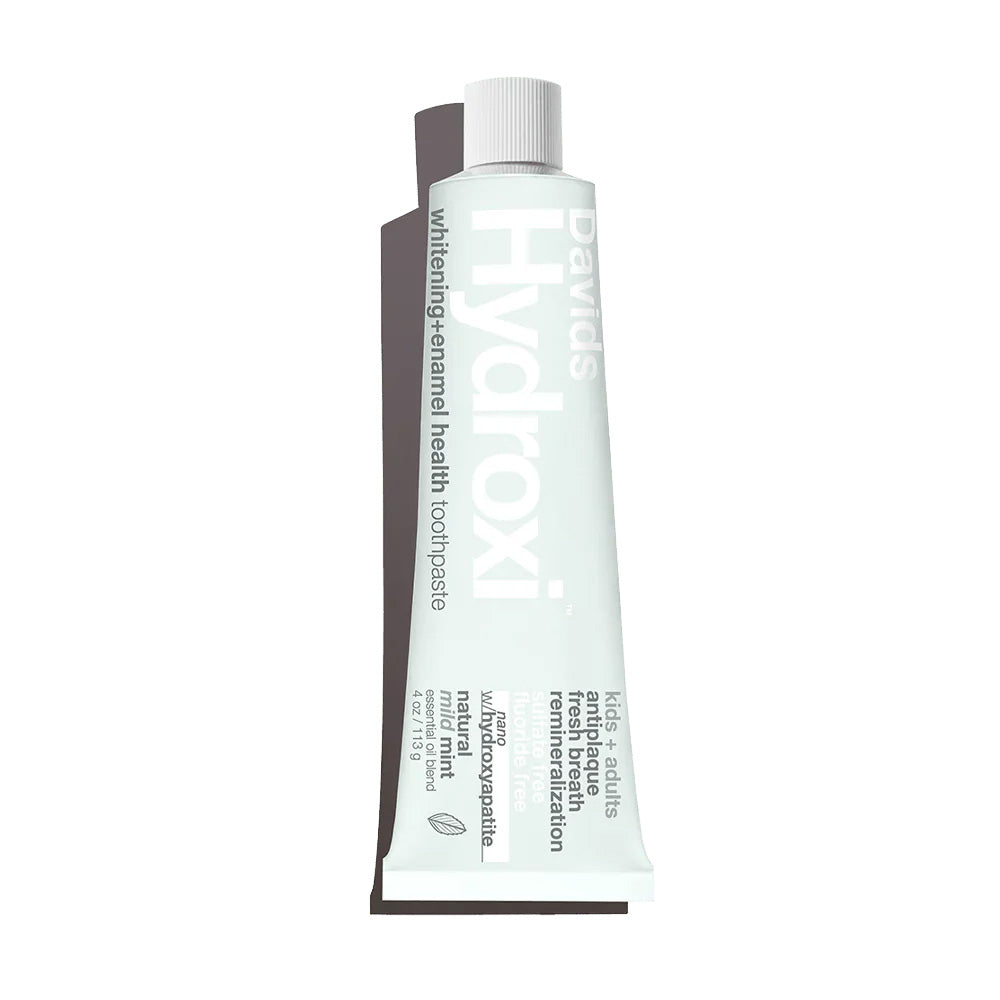 David's Hydroxi toothpaste tube in pale blue with white cap, featuring natural mild mint formula for whitening and enamel health