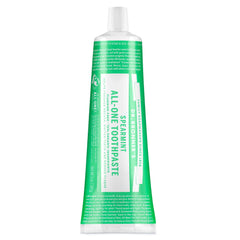 Dr. Bronner's Spearmint Green and white toothpaste tube on a white background