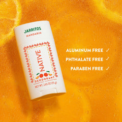 Jarritos Mandarin Native deodorant on a textured orange background