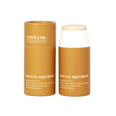 Routine Bonita Applebom deodorant sticks side by side—one with its mustard-yellow paper cap on, the other with the cap removed to display the pale-yellow deodorant stick—set against a clean white background.