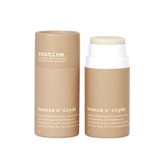 Two Ccose-up of Routine Bonnie n’ Clyde sticks, One is  twisted up with product exposed and creamy texture the other is with a closed lid.