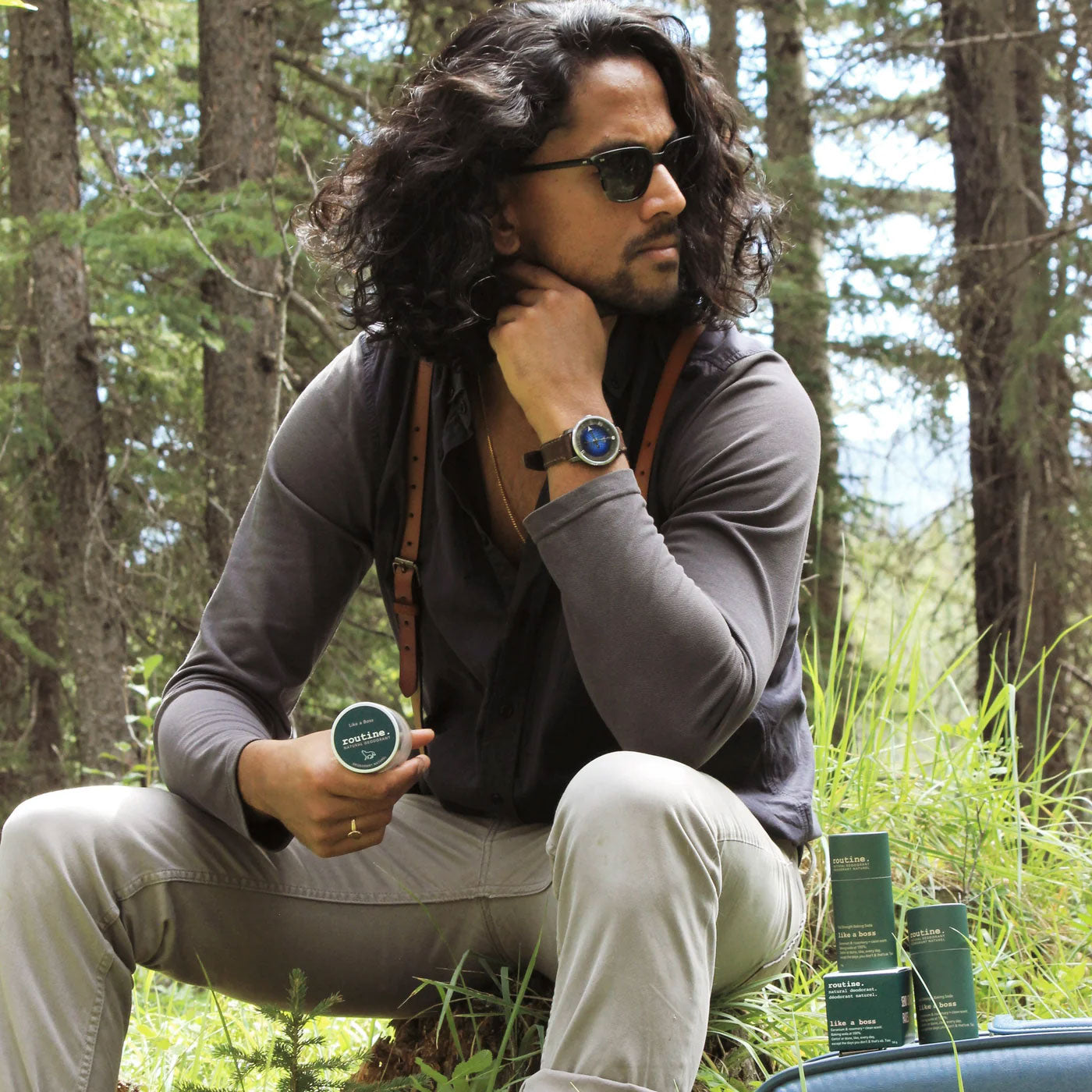 routine Like a Boss lifestyle photo - man in outdoor setting holding deodorant jar showcasing natural product for active lifestyles - confidence and freshness for busy days