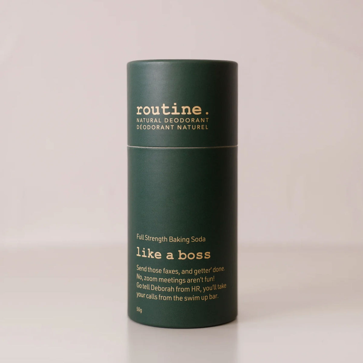 routine. Like A Boss Deodorant Stick being displayed on a clean surface showing recyclable paperboard tube.