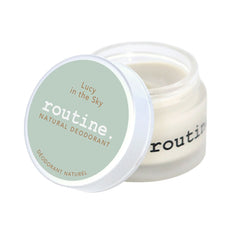 routine Lucy in the Sky deodorant jar open showing cream-coloured natural deodorant texture with sage green lid displaying product name and natural deodorant text