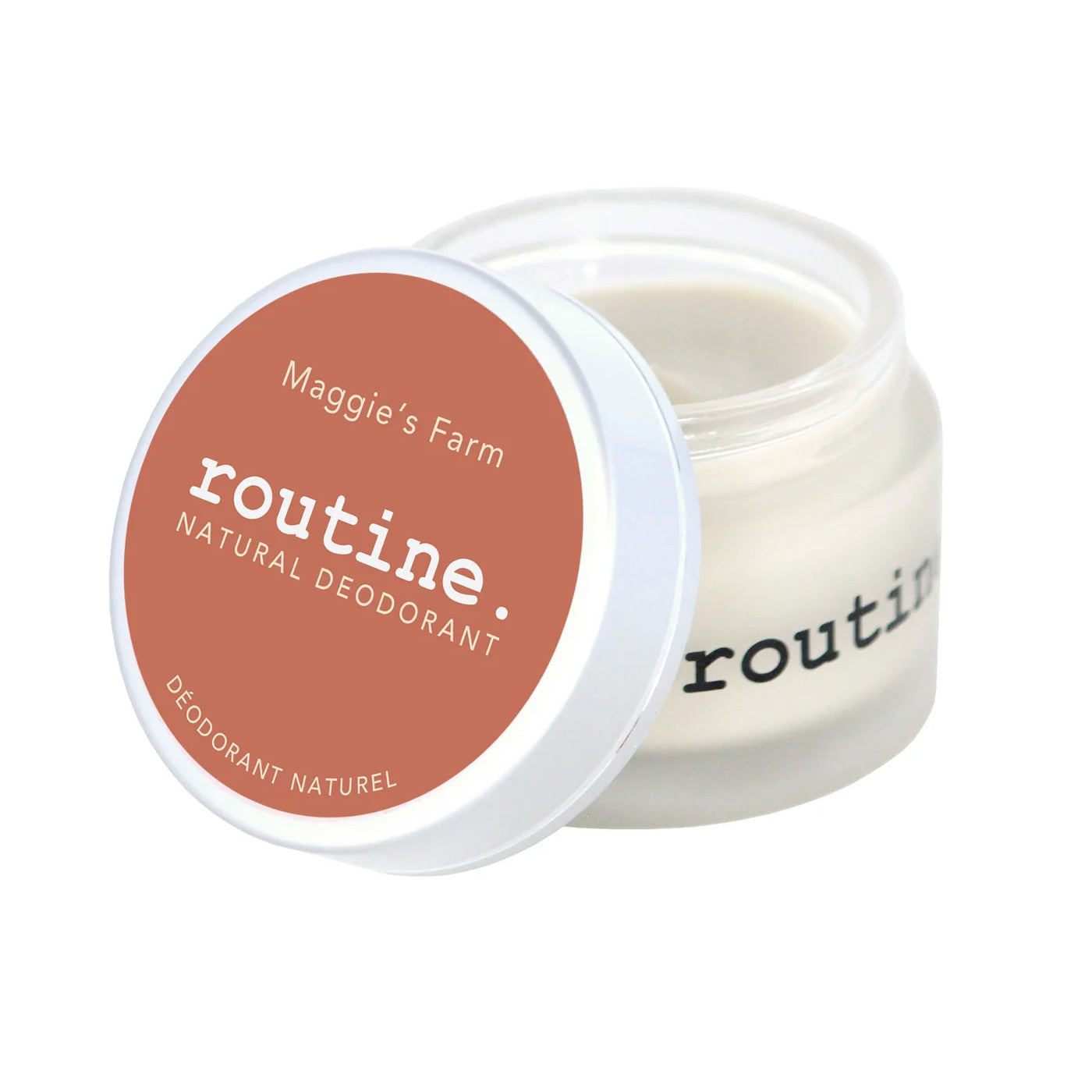 Routine Maggie's Farm deodorant - open glass jar displaying white cream texture with orange coral lid - natural ingredients visible in smooth consistency