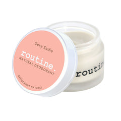routine Sexy Sadie deodorant jar - open glass container with coral pink lid showing smooth cream texture - natural multi-use formula with ylang ylang and vanilla oils