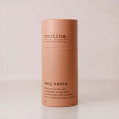 Sexy Sadie Natural Deodorant stick on a white countertop showing minimalist eco-friendly packaging.