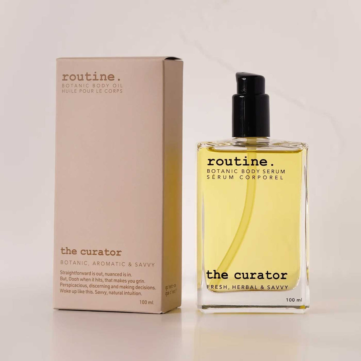 routine The Curator Botanic Body Oil in 100ml glass bottle with black pump next to warm beige cardboard packaging showing fresh, herbal & savvy scent description