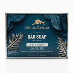 Front of Tommy Bahama Lime & Coconut Bar Soap for Men box featuring gold marlin logo, palm leaf illustration, and "lime & coconut" scent label on teal background
