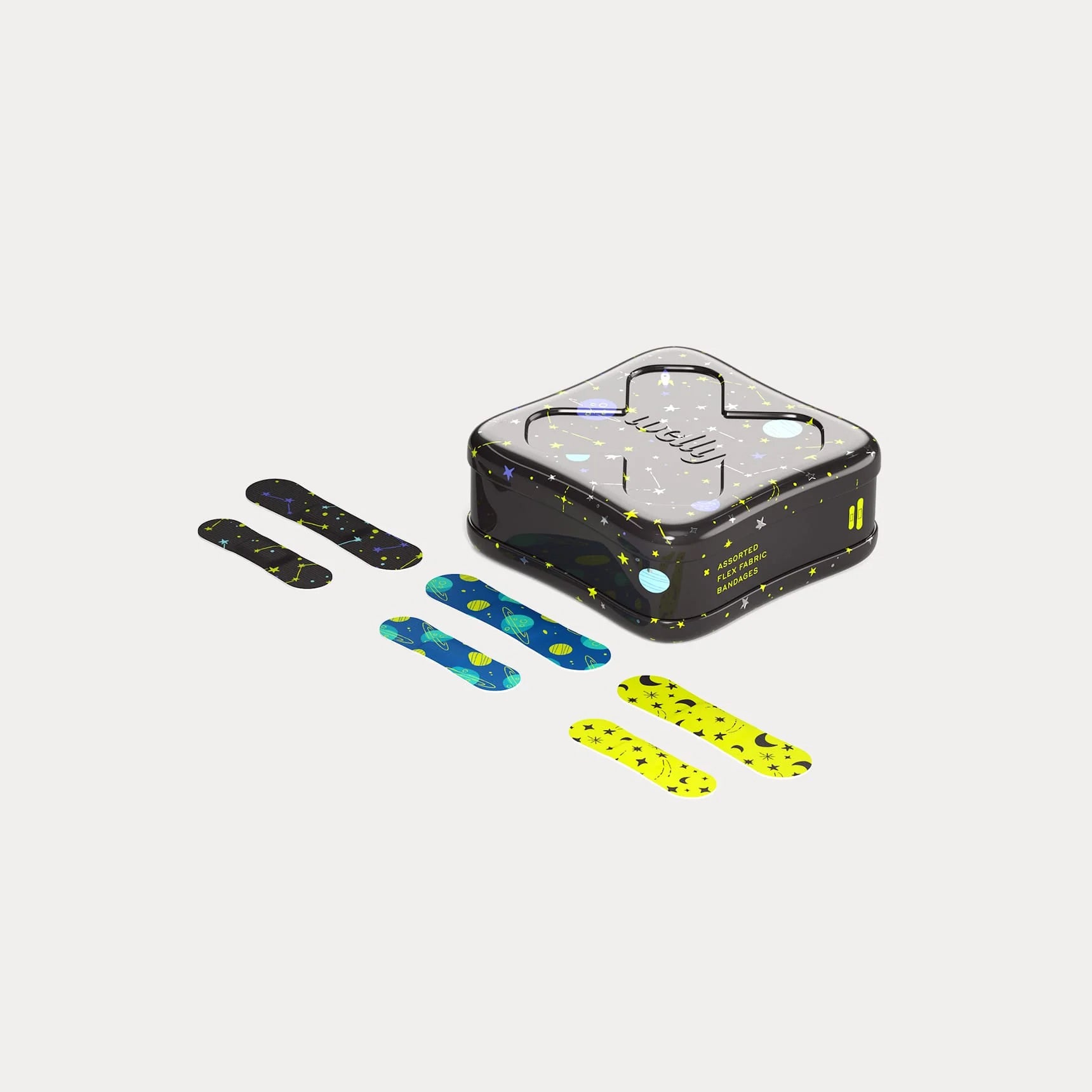 Open Welly Space bandages tin displaying assorted flex fabric bandages in three patterns - black with white stars, blue with planets, and yellow with moons and stars